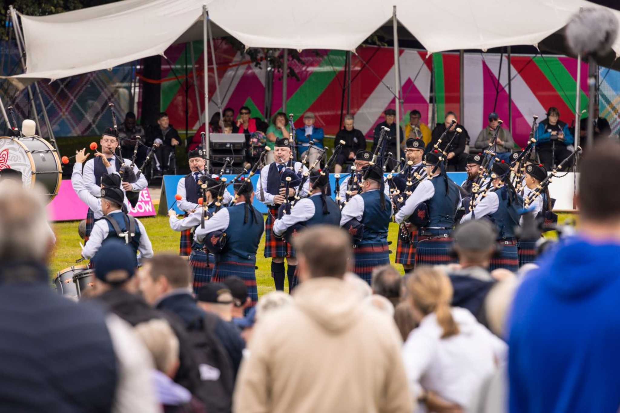 Crowds enjoying pipers