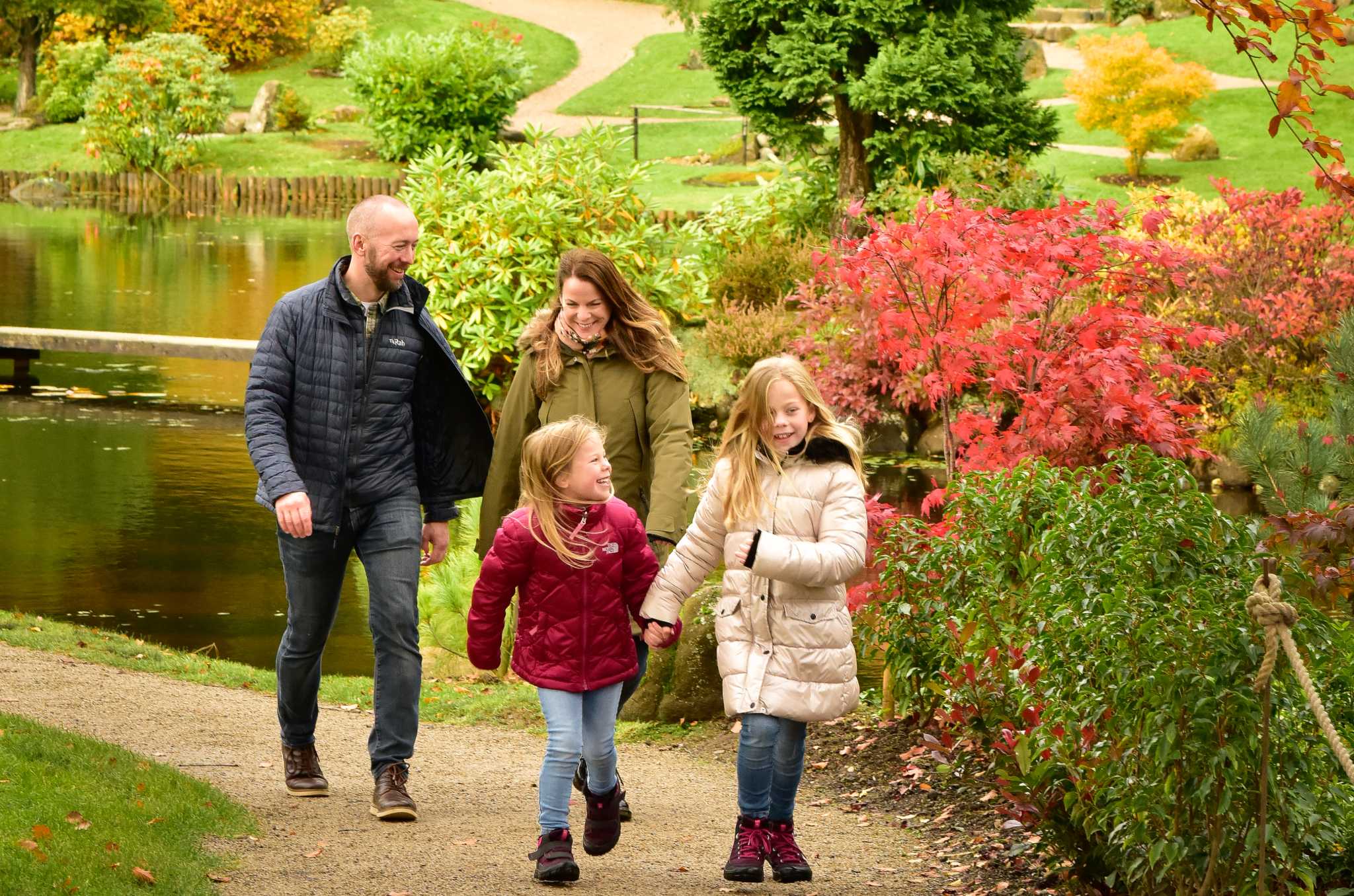 Visitors in colourful Japanese style garden