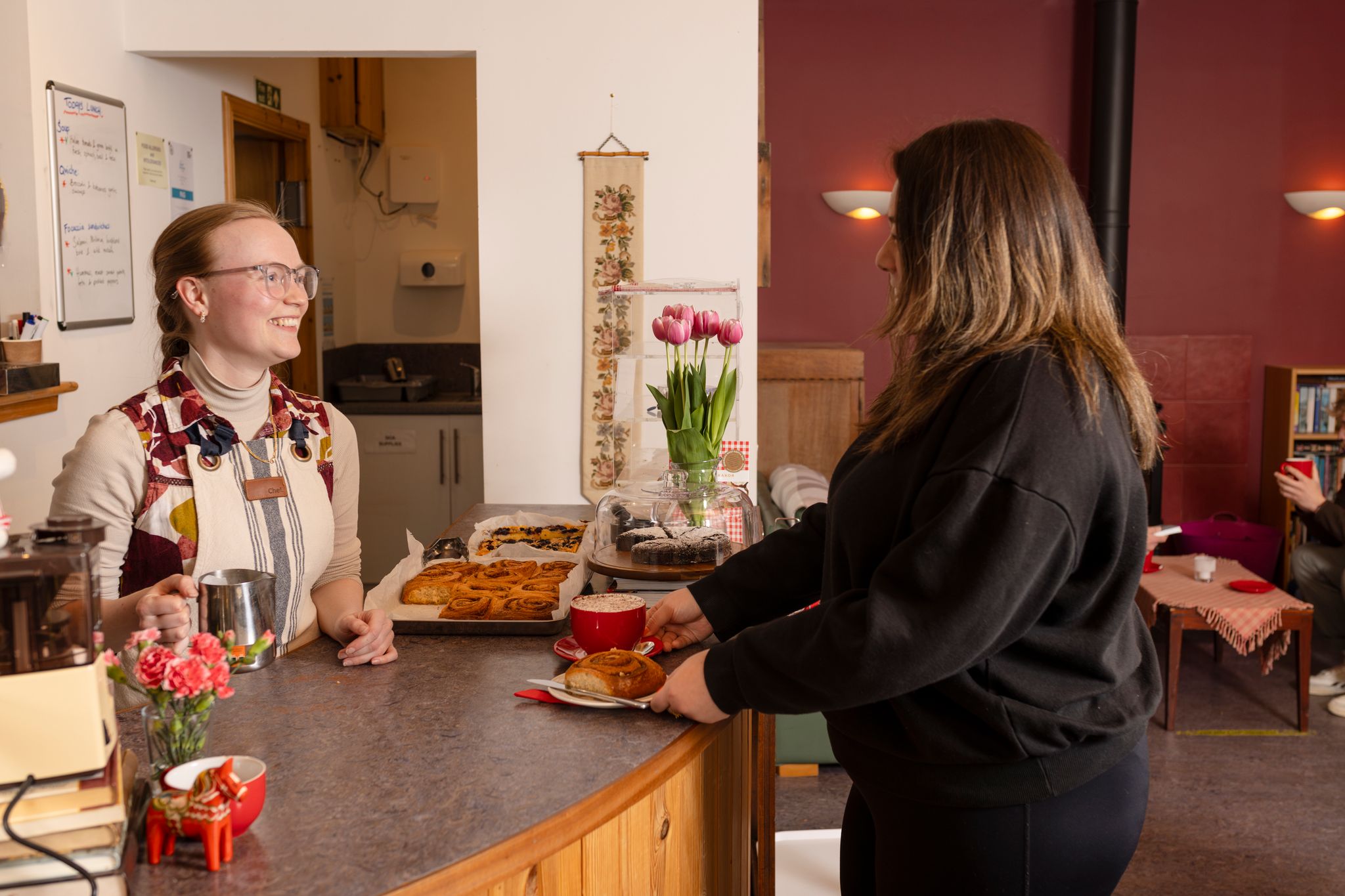 Customer being served at bakery