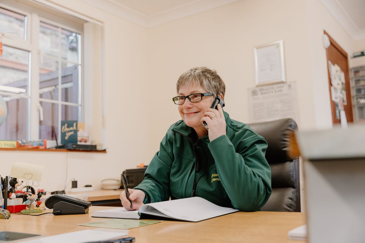 Woman working at computer in reception area