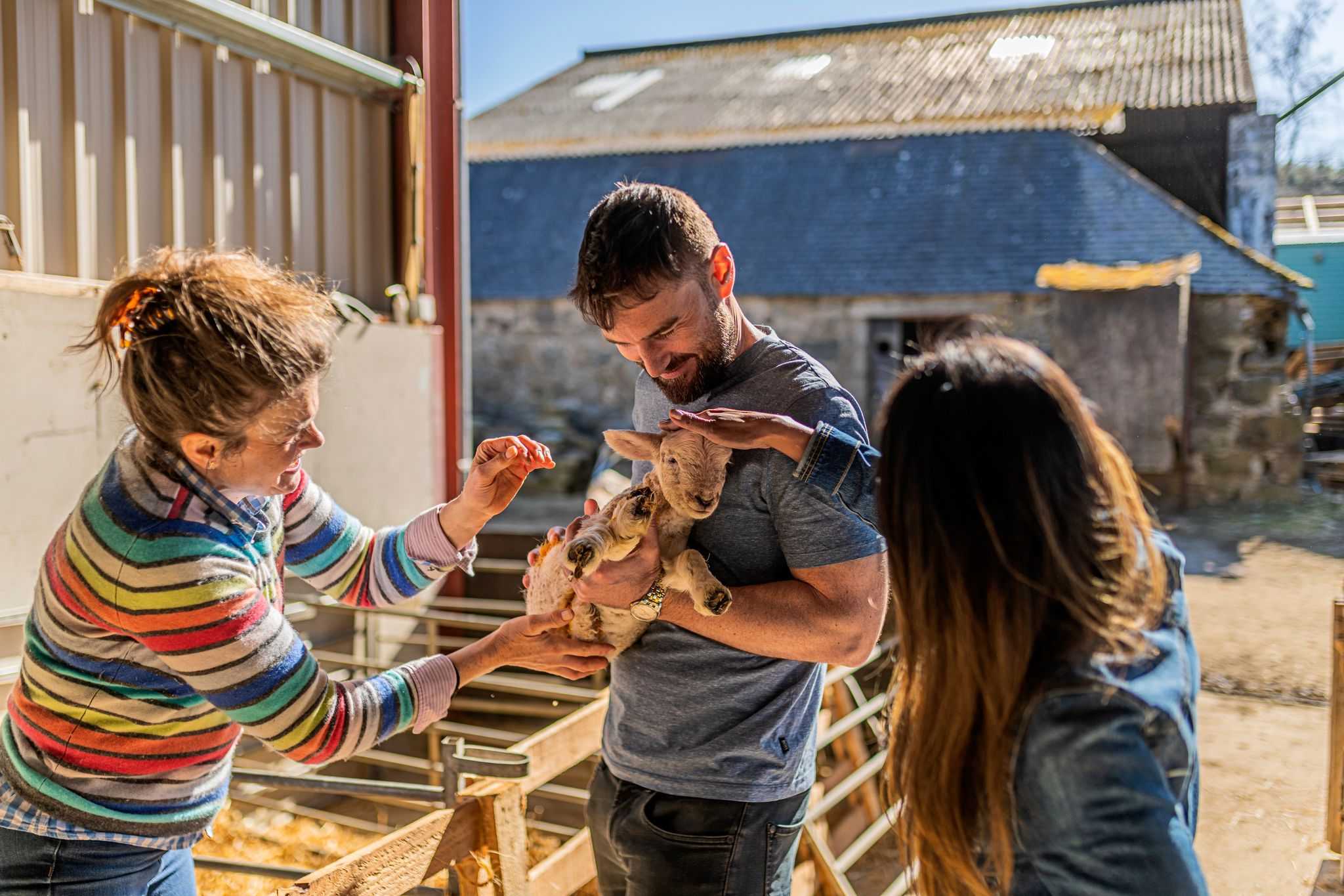 Visitors at table outside Boutique farm bothy