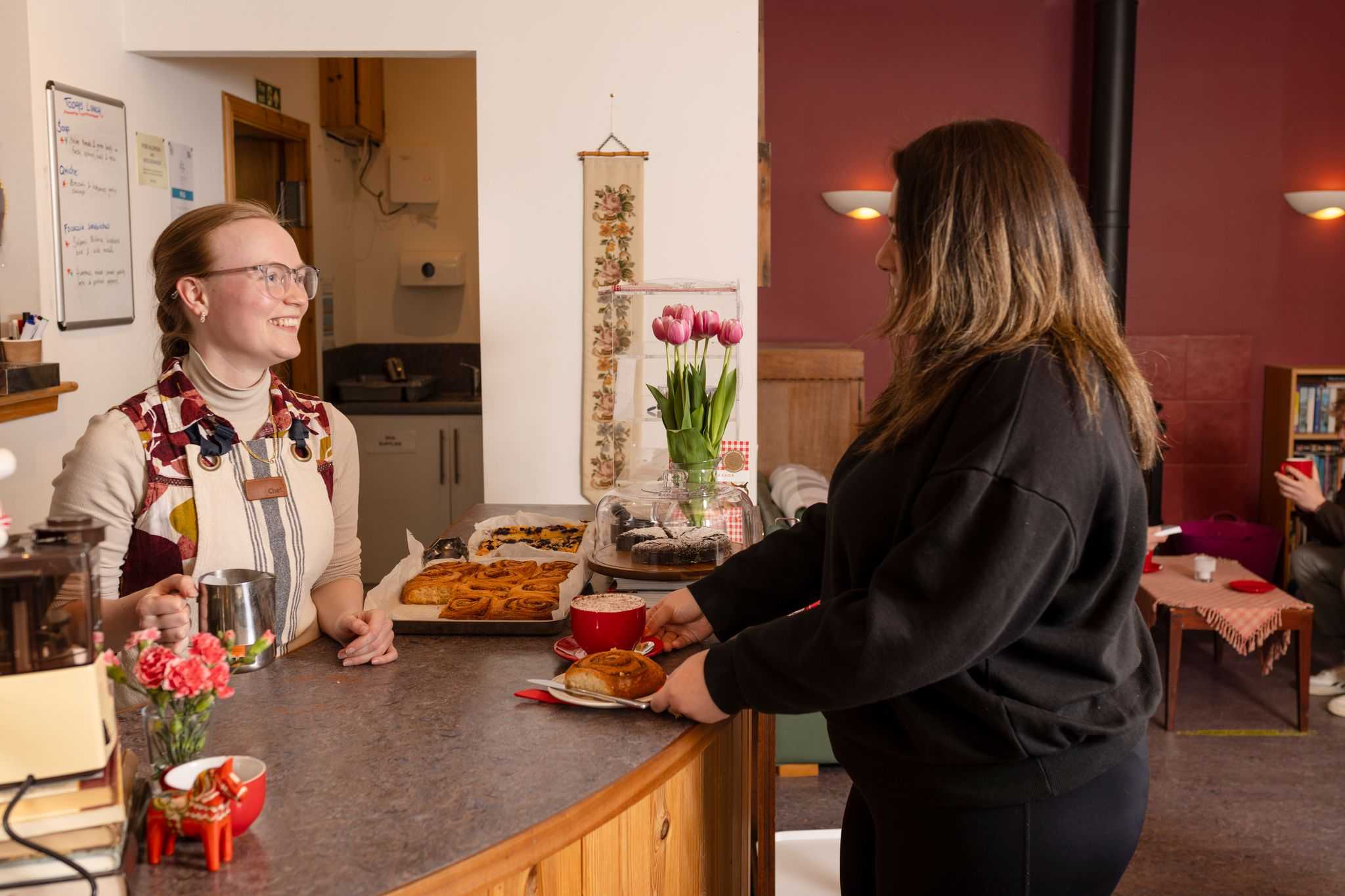 Customer being served ta bakery